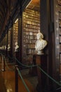 The Long Room interior Of The Old Library At Trinity College. Marble busts of great people and shelves with antique tomes Royalty Free Stock Photo