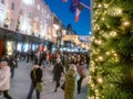 Dublin, Ireland - 20.12.2022: Lights on a fur tree decoration and Decorated and illuminated Grafton street in the Irish capital