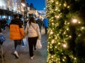 Dublin, Ireland - 20.12.2022: Lights on a fur tree decoration and Decorated and illuminated Grafton street in the Irish capital