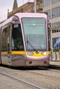Beautiful vertical closeup view of Luas tram in Dublin city centre beside Stephens Green Green Royalty Free Stock Photo