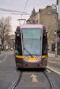 Beautiful vertical closeup view of Luas tram in Dublin city centre beside Stephens Green Green Royalty Free Stock Photo