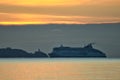 Beautiful early morning view of Irish Ferry ship in Irish Sea near Baily lighthouse seen from Blackrock beach, Dublin