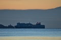 Beautiful early morning view of Stena Line ferry ship in Irish Sea near Baily lighthouse seen from Blackrock beach