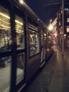 Dublin, Ireland - 12.11.2021: Night scene. Luas rail service tram moving to town center. Motion blur. City life Royalty Free Stock Photo