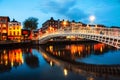 Dublin, Ireland. Night view of famous illuminated Ha Penny Bridge Royalty Free Stock Photo