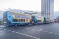 Dublin`s yellow city buses on O`Connell bridge Royalty Free Stock Photo