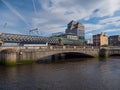 Dublin, Ireland - River Liffey Bridge, and Rail Bridge with DART train