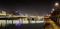 Dublin Ireland River Liffey at Night with harp bridge reflections UK