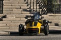 Can-Am Spyder Roadster car on the street by outdoor stone stairs in Dublin during the COVID-19 lockdown