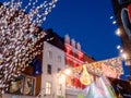 Dublin, Ireland - 20.12.2022: Willow tree for sale and Decorated and illuminated Grafton street in the Irish capital at dusk