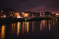 Dublin`s night cityscape with bridge over Liffey river Royalty Free Stock Photo
