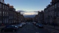 Dublin Street in cold early morning. Edinburgh cityscape with sunrise in background. Clear blue sky.