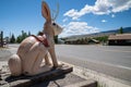 The Worlds Largest Jackalope statue at the gas station along the roadside. Wearing a mask due to