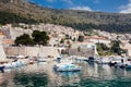 Dubrovnik city old port marina and fortifications in a beautiful early spring day Royalty Free Stock Photo