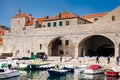 Dubrovnik city old port marina and fortifications in a beautiful early spring day Royalty Free Stock Photo