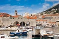 Dubrovnik city old port marina and fortifications in a beautiful early spring day Royalty Free Stock Photo