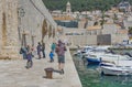 Dubrovnik old town harbor atmosphere with local small boats moored