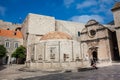 Tourists at the Large Onofrio Fountain located at Stradun street in the old town of Dubrovnik Royalty Free Stock Photo