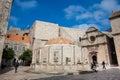 Tourists at the Large Onofrio Fountain located at Stradun street in the old town of Dubrovnik Royalty Free Stock Photo