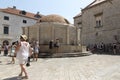 People quench their thirst near the fountain with water Royalty Free Stock Photo