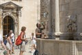 People quench their thirst near the fountain with water Royalty Free Stock Photo