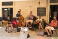 Quartet of street musicians entertains tourists