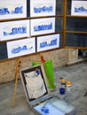 Dubrovnik, Croatia, August 5, 2020. Street artist`s easel with sketches and paints. The home of a landscape painter. Tourist