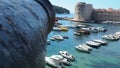 Dubrovnik, Croatia, 08.14. 2022. City port summer tourist attraction. Tourists walk, get into boats and ships and go on