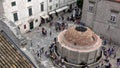 4K. Tourists in the Large Onofrio Fountain in Dubrovnik Old Town, Croatia