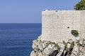 View of Old City Walls with one of towers, surrounding medieval city on the Adriatic Sea, Dubrovnik, Croatia Royalty Free Stock Photo