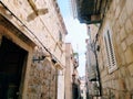 Dubrovnik, Croatia, 08.14. 2022. Narrow streets of the ancient town. The facades of the houses are made of marble and Royalty Free Stock Photo