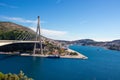 Dubrovnik Croatia October 2020 Massive suspension bridge at the entrance of Dubrovnik city. Bay area with boats in the harbour on Royalty Free Stock Photo