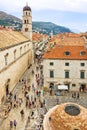 Dubrovnik, Croatia. Street Stradun, tourists, church of St. Saviour and Big Onofrio`s fountain Royalty Free Stock Photo