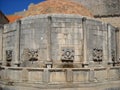 Dubrovnik, Dalmatia, Croatia, August 5, 2010 The Great Onofrio Fountain on Stradun Street. The stone building is made in the form