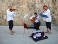 Dubrovnik, Dalmatia, Croatia, August 5, 2010. Street musicians play musical instruments. Traditional white shirts, red berets.