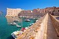 Dubrovnik. Historic city walls walk and Saint Ivan fortress in Dubrovnik harbor view