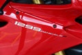 Ducati Panigale 1299: Close-up of model inscription on fairing, color red.