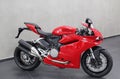 Ducati Panigale 959: Panoramic view of motorcycle, isolated red color