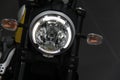 Ducati Scrambler Icon : Close-up of motorcycle headlight.