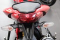 Ducati Streetfighter 848: Closeup of motorcycle rear, isolated, red color.