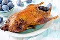 Duck baked with plums and spices