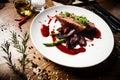 Duck breast with asparagus, salad and sauce on white plate. Delicious healthy grilled and roasted bird fillet food Royalty Free Stock Photo