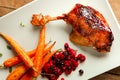 Duck confit with carrots and berries