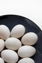 Duck eggs on blue plate on a white background Royalty Free Stock Photo