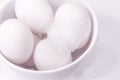 Duck eggs in white bowl