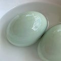 Duck Eggs on A White Bowl of Water Royalty Free Stock Photo