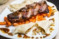 Duck (goose) breast with buckwheat dumplings and carrot