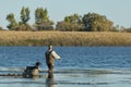 A duck hunter and his dog on a North Dakota Wetland Royalty Free Stock Photo