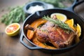 duck a lorange in a cast iron skillet with sauce Royalty Free Stock Photo