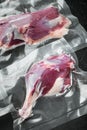 Duck meat vacuum packed , on black stone background Royalty Free Stock Photo